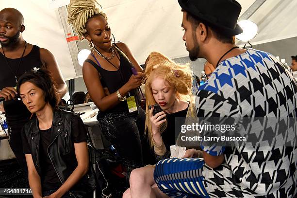 Models prepare backstage at the Etxeberria fashion show during Mercedes-Benz Fashion Week Spring 2015 at The Pavilion at Lincoln Center on September...
