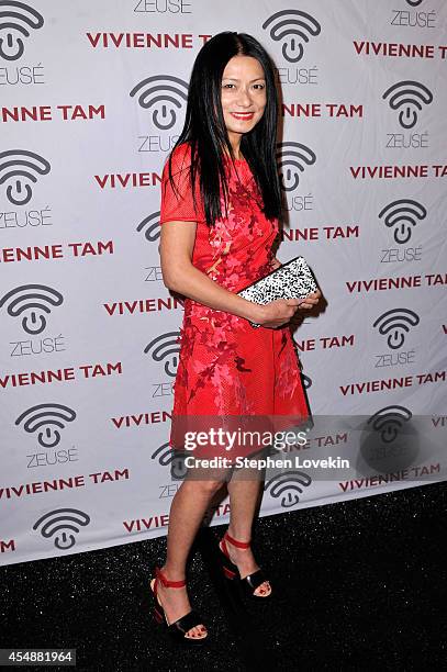 Designer Vivienne Tam poses backstage at the Vivienne Tam fashion show during Mercedes-Benz Fashion Week Spring 2015 at The Theatre at Lincoln Center...