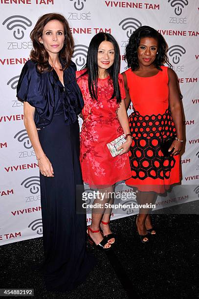 Cristina Ehrlich, Vivienne Tam and Uzo Aduba pose backstage at the Vivienne Tam fashion show during Mercedes-Benz Fashion Week Spring 2015 at The...