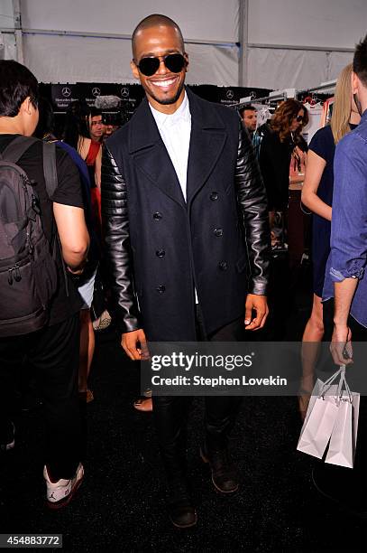 Eric West poses backstage at the Vivienne Tam fashion show during Mercedes-Benz Fashion Week Spring 2015 at The Theatre at Lincoln Center on...