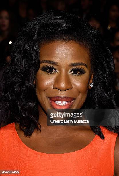 Actress Uzo Aduba poses backstage at the Vivienne Tam fashion show during Mercedes-Benz Fashion Week Spring 2015 at The Theatre at Lincoln Center on...