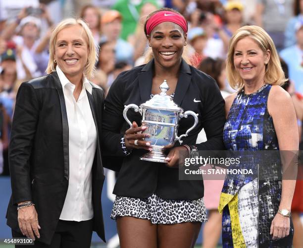 Serena Williams of the US holds the US Open trophy after defeating Caroline Wozniacki of Denmark during their US Open 2014 women's singles finals...