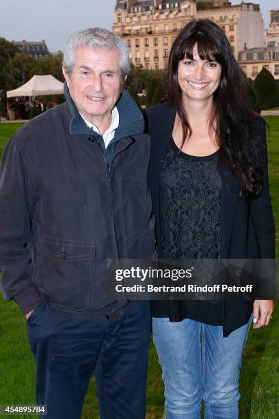 Director Claude Lelouch and his companion Photographer Valerie Perrin attend the 'Claude Lelouch en Musique ! Held at the Invalides in Paris on...