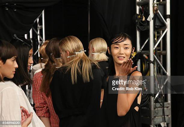 Models backstage at Vivienne Tam during Mercedes-Benz Fashion Week Spring 2015 at The Theatre at Lincoln Center on September 7, 2014 in New York City.