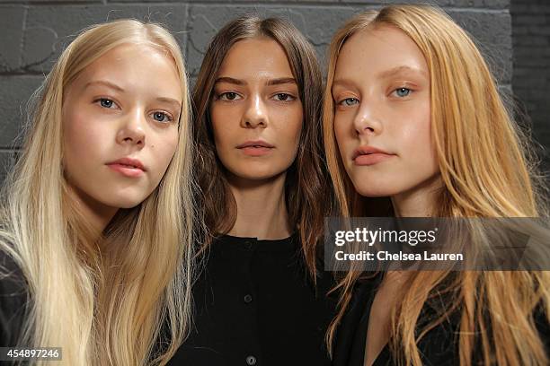 Models pose backstage at the Yigal Azrouel fashion show on September 7, 2014 in New York City.