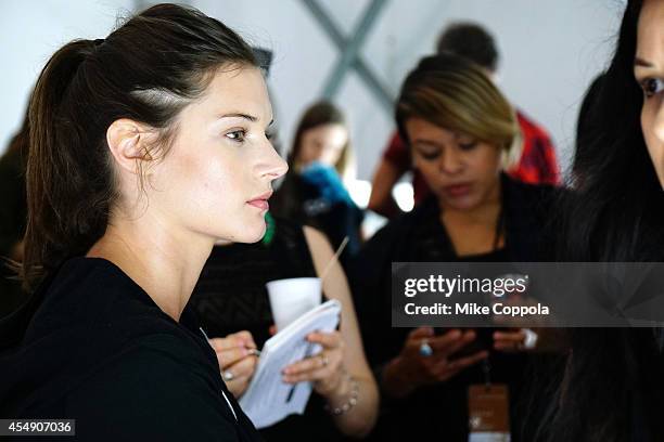 Models prepare backstage during the Mercedes-Benz Lounge during Mercedes-Benz Fashion Week Spring 2015 at Lincoln Center on September 7, 2014 in New...