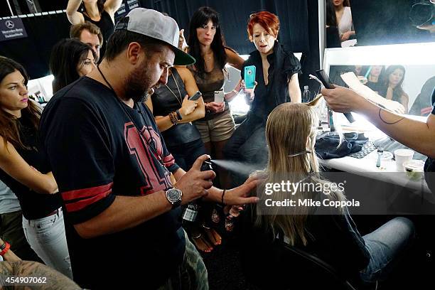 Models prepare backstage during the Mercedes-Benz Lounge during Mercedes-Benz Fashion Week Spring 2015 at Lincoln Center on September 7, 2014 in New...