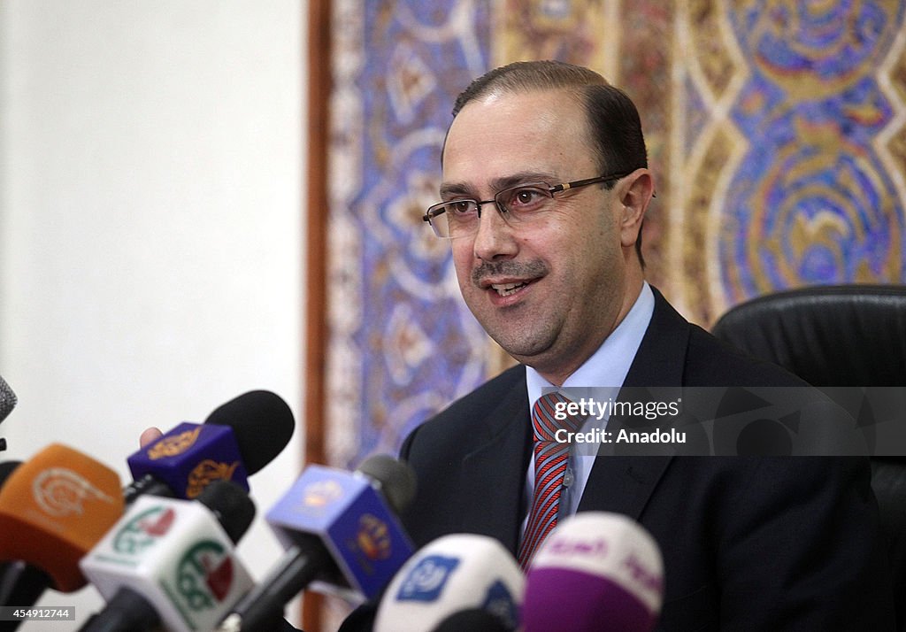 Jordanian minister Mohammad Momani speaks to press in Amman