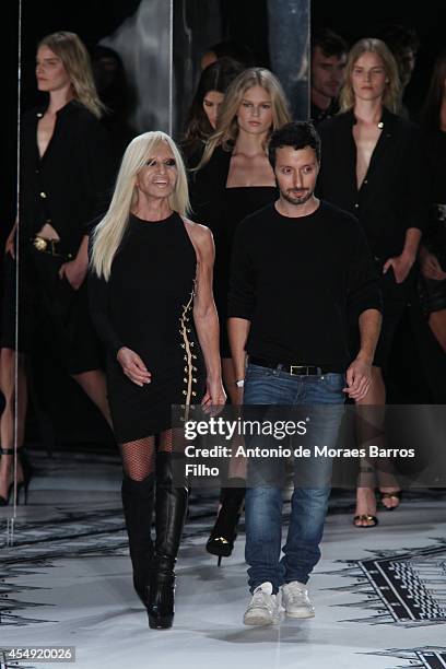 Donatella Versace and Antony Vaccarello walk the runway during the VERSUS by Antony Vaccarello show at Mercedes-Benz Fashion Week Spring 2015 on...