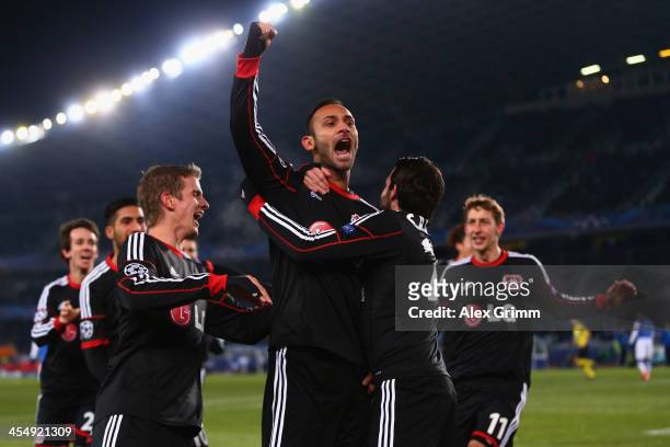 Oemer Toprak of Leverkusen celebrates his team's first goal with team mates during the UEFA Champions League Group A match between Real Sociedad de...