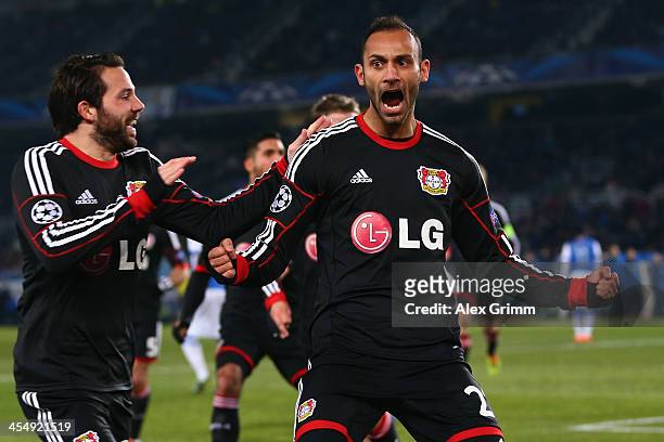 Oemer Toprak of Leverkusen celebrates his team's first goal with team mate Gonzalo Castro during the UEFA Champions League Group A match between Real...