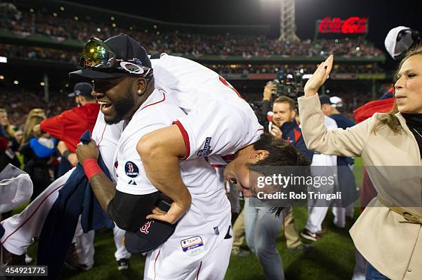 David Ortiz and Koji Uehara of the Boston Red Sox celebrate after the defeating the Detroit Tigers in Game Six of the American League Championship...