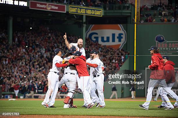 The Boston Red Sox celebrate after defeating the Detroit Tigers in Game Six of the American League Championship Series to clinch the American League...