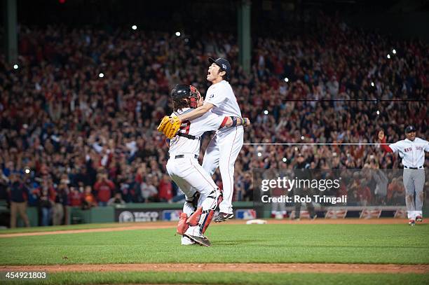 Jarrod Saltalamacchia and Koji Uehara of the Boston Red Sox celebrate after defeating the Detroit Tigers in Game Six of the American League...