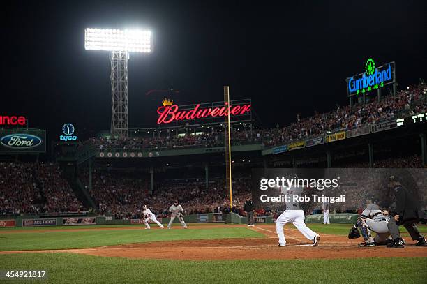 Shane Victorino of the Boston Red Sox hits a grand slam home run against Jose Veras of the Detroit Tigers in the seventh inning during Game Six of...