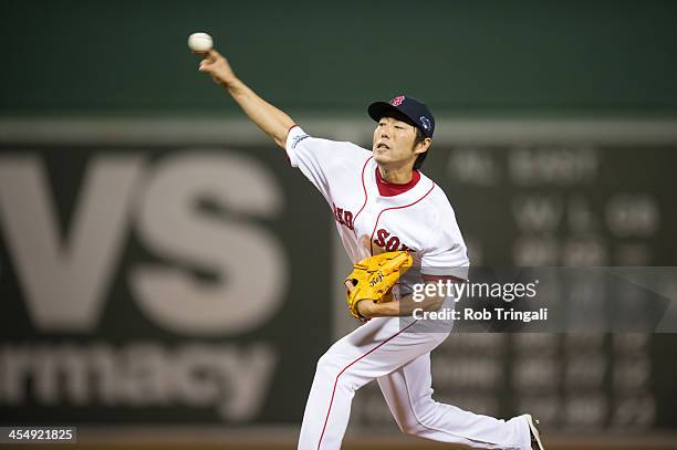 Koji Uehara of the Boston Red Sox throws a pitch against the Detroit Tigers in the ninth inningduring Game Six of the American League Championship...