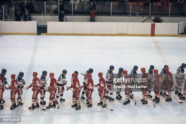 Winter Olympics: Overall view of Team USA players and USSR players shaking hands after Medal Round game at Olympic Fieldhouse in the Olympic Center....