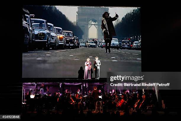 Singers Lisa Angell and Vincent Niclo perform during the 'Claude Lelouch en Musique ! Held at the Invalides in Paris on September 6, 2014 in Paris,...