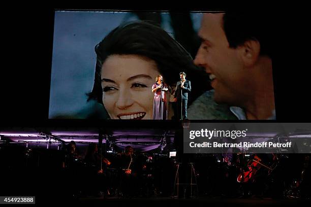 Singers Lisa Angell and Vincent Niclo perform during the 'Claude Lelouch en Musique ! Held at the Invalides in Paris on September 6, 2014 in Paris,...