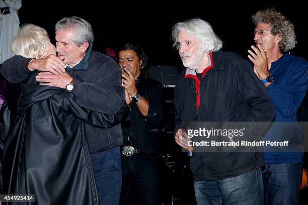 Singer Nicole Croisille, director Claude Lelouch, singer Pierre barouh and stage director Elie Chouraqui on stage at the end of the 'Claude Lelouch...