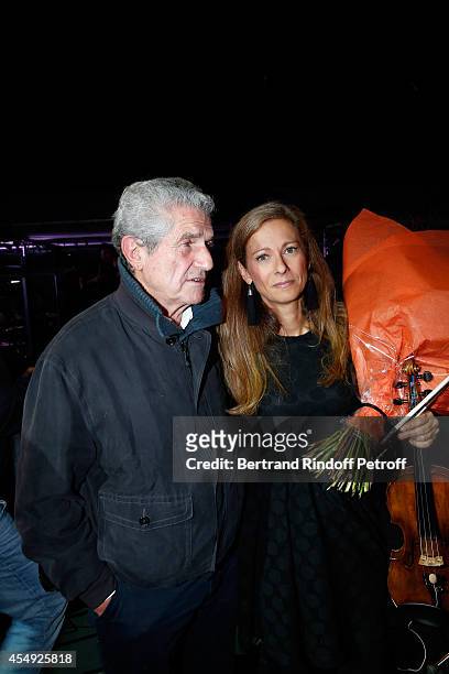 Director Claude Lelouch and Violonist Anne Gravoin on stage at the end of the 'Claude Lelouch en Musique ! Held at the Invalides in Paris on...