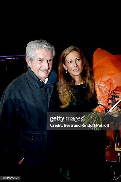 Director Claude Lelouch and Violonist Anne Gravoin on stage at the end of the 'Claude Lelouch en Musique ! Held at the Invalides in Paris on...