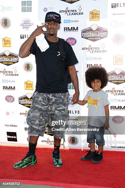 Rapper Daylight and his son attend the 2nd Annual Celebrity Flag Football Game benefiting Athletes VS. Cancer at Granada Hills Charter High School on...