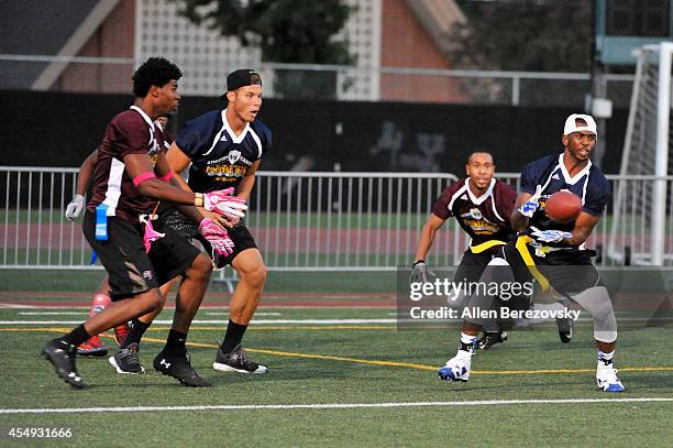 Players Chris Paul and Blake Griffin participate in the 2nd Annual Celebrity Flag Football Game benefiting Athletes VS. Cancer at Granada Hills...