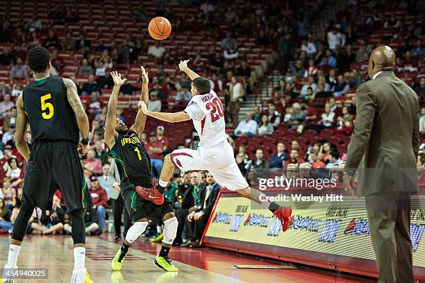 Kikko Haydar of the Arkansas Razorbacks saves the ball from going out of bounds during a game against the SE Louisiana Lions at Bud Walton Arena on...