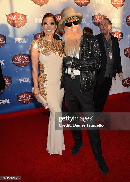 Musician Billy Gibbons of ZZ Top and wife Gilligan Stillwater arrive at the American Country Awards 2013 at the Mandalay Bay Events Center on...