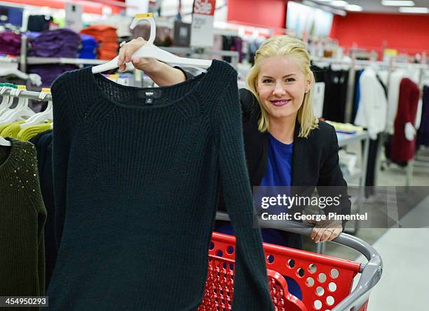 Actress Elisha Cuthbert makes an in-store Holiday appearance at Target at Shoppers World Danforth on December 10, 2013 in Toronto, Canada.