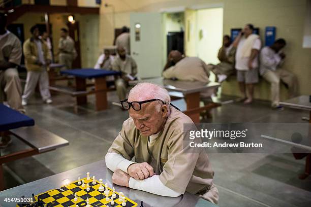 Nathan Brown , a prisoner at Rhode Island's John J. Moran Medium Security Prison, plays chess against another inmate on December 10, 2013 in...