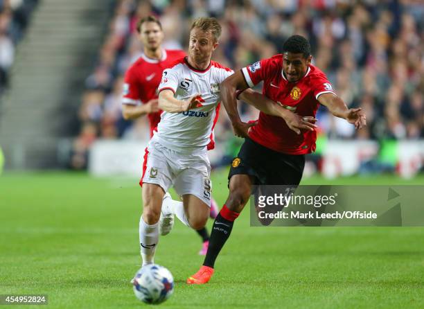 Dean Bowditch of MK Dons tangles with Saidy Janko of Manchester United at Stadium mk on August 26, 2014 in Milton Keynes, England.