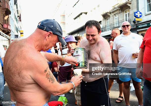 England fans enjoy a beer in the sunshine ahead of the UEFA EURO 2016 Qualifier between Switzerland and England on September 8, 2014 in Basel,...