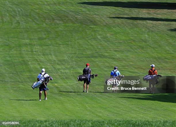 Amateur golfers in action as photographed on the Bethpage State Park Black Golf Course on September 6, 2014 in Bethpage, New York.