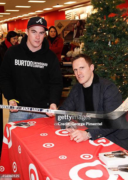 Professional hockey player Dion Phaneuf signs autographs during an in-store Holiday appearance at Target at Shoppers World Danforth on December 10,...