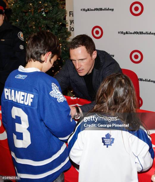 Professional hockey player Dion Phaneuf signs autographs during an in-store Holiday appearance at Target at Shoppers World Danforth on December 10,...