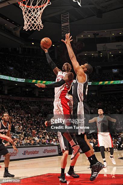 December 10: Terrence Ross of the Toronto Raptors drives to the basket against the San Antonio Spurs on December 10, 2013 at the Air Canada Centre in...