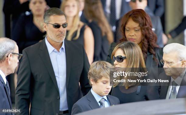 Melissa Rivers, daughter of comedienne Joan Rivers, right and Cooper Endicott grandson of Rivers, leaves after a funeral service for Rivers at Temple...