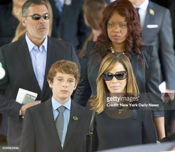 Melissa Rivers, daughter of comedienne Joan Rivers, right and Cooper Endicott grandson of Rivers, leaves after a funeral service for Rivers at Temple...