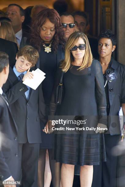 Melissa Rivers, daughter of comedienne Joan Rivers, right and Cooper Endicott grandson of Rivers, leaves after a funeral service for Rivers at Temple...