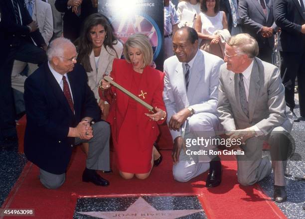 Honorary Hollywood Mayor Johnny Grant, comedienne Joan Rivers and daughter Melissa, Mayor Tom Bradley and television announcer Bill Welsh attend Joan...