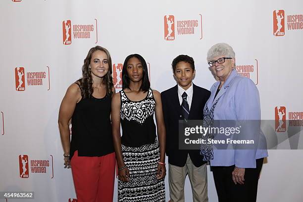 Superstar Little League pitcher Mo'ne Davis and teammate Scott Bandura pose with Becky Hammon and Lin Dunn during the Inspiring Women Luncheon on...