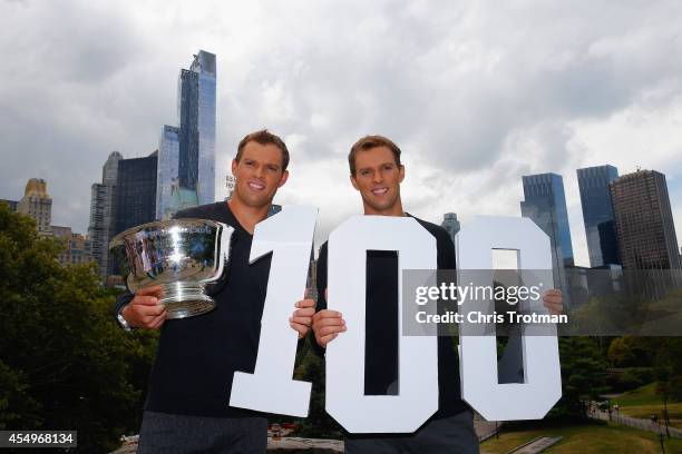 Bob Bryan and Mike Bryan of United States pose with the US Open men's doubles champions trophy in Central Park during their New York City media tour...