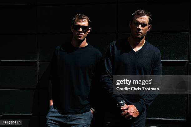 Bob Bryan and Mike Bryan of United States the US Open men's doubles champions trophy look on during their New York City media tour after winning...