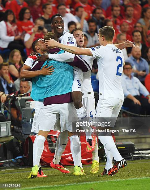 Danny Welbeck of England celebrates with team mates Alex Oxlade-Chamberlain Calum Chambers , , Jordan Henderson and John Stones as he scores their...