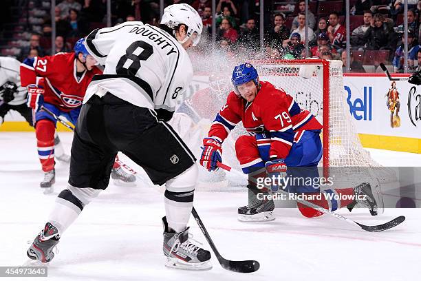 Andrei Markov of the Montreal Canadiens gets down to block a shot by Drew Doughty of the Los Angeles Kings during the NHL game at the Bell Centre on...