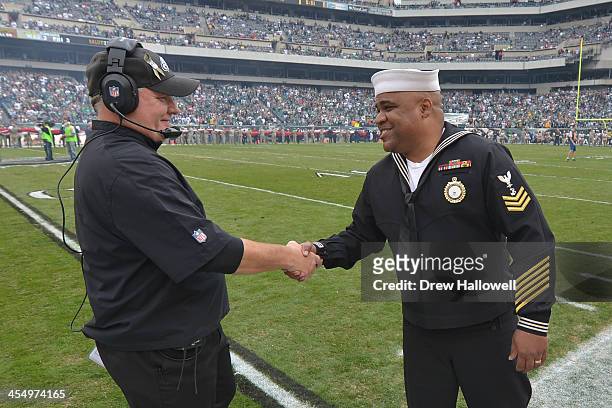 Head coach Chip Kelly of the Philadelphia Eagles greets a US Navy sailor before the game against the Washington Redskins at Lincoln Financial Field...