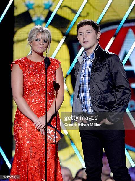 Presenters Lauren Alaina and Scotty McCreery speak onstage during the American Country Awards 2013 at the Mandalay Bay Events Center on December 10,...