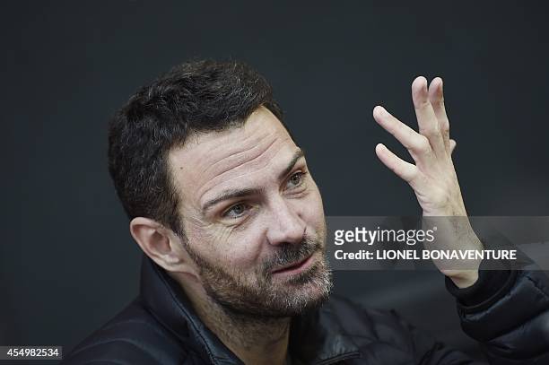 French rogue trader of the Societe Generale bank, Jerome Kerviel, gestures on September 8, 2014 in Paris, after he left from a prison in a southern...